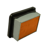 Three-quarter angle showing reverse/bottom face with grey metal end cap and partial pleated element visible, black rubber gasket surround prominent.