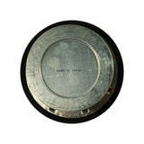 Bottom plan view showing galvanised steel base plate with concentric ring, open central bore, and 'MADE IN JAPAN' stamp in the centre