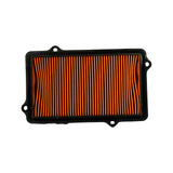 Top-down flat shot showing full face of filter element. Orange pleated media, rectangular with slightly rounded corners, black rubber perimeter frame. Mounting tabs visible at each corner.